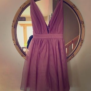 Deep v  strappy tulle Cocktail dress.